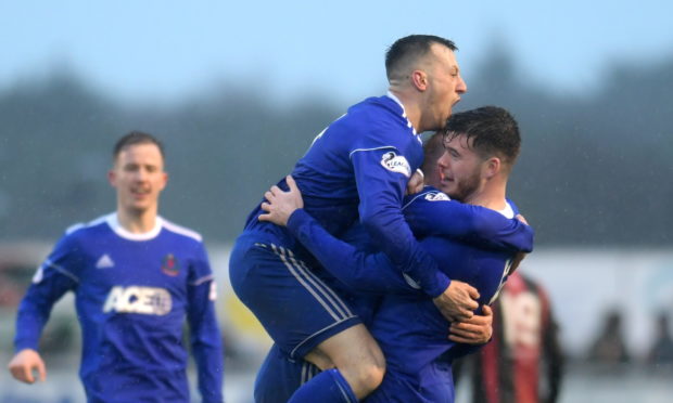 Cove's Daniel Higgins celebrates his goal. 
Picture by KATH FLANNERY