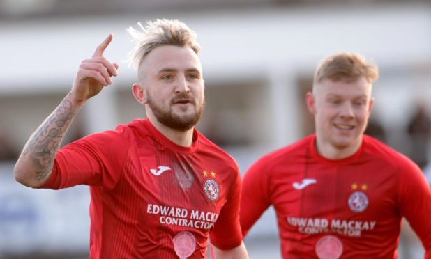 Brora's Paul Brindle scores the winning goal. 

Picture by KATH FLANNERY