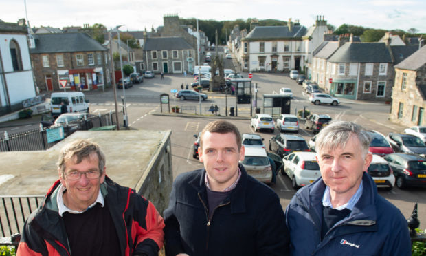 Cullen Community Council member Stan Slater, Moray MP Douglas Ross and Keith and Cullen councillor Donald Gatt have campaigned for a new ATM in Cullen. Picture by Jason Hedges.