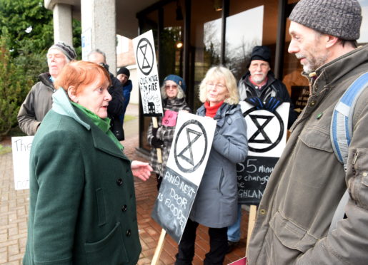 Climate activists protest outside the Highland Council headquarters in Inverness.
Picture by Sandy McCook.