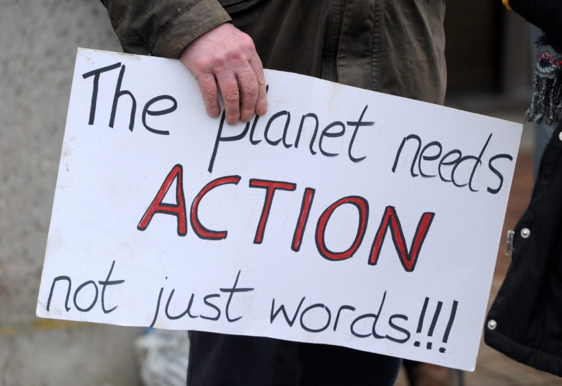 Climate activists protest outside the Highland Council headquarters in Inverness.
Picture by Sandy McCook.