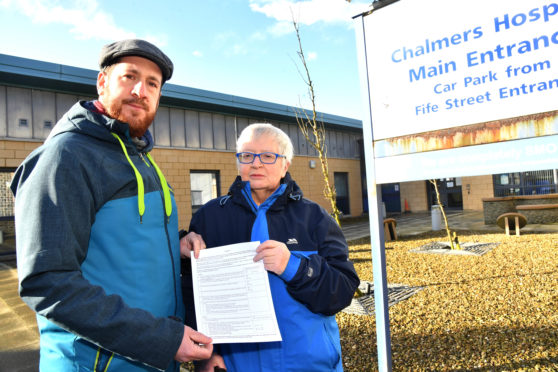 Rob McArthur, community council vice chairman and Janet Anderson, friends of chalmers hospital chairwoman, with the public survey.