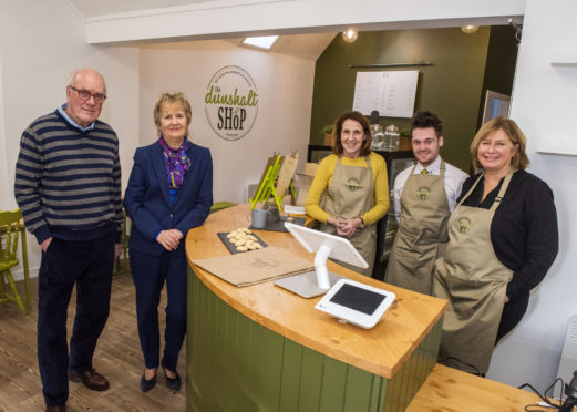 Staff members of the Dunshalt Community shop in Scotland.