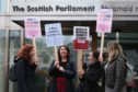Monica Lennon MSP (second left) joins supporters of the Period Products bill at a rally outside Parliament in Edinburgh.