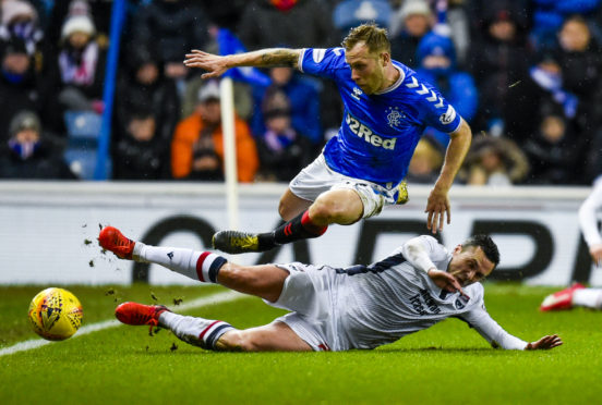 Ross County midfielder Don Cowie in action against Rangers.