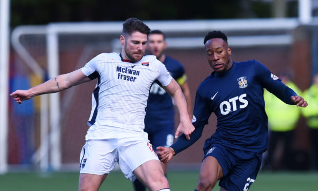 Ross County's Iain Vigurs battles with Nicke Kabamba.