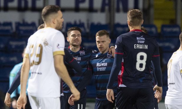 Iain Vigurs embraces Billy Mckay after he opened the scoring in the third minute