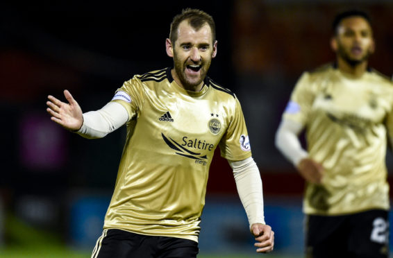 Niall McGinn celebrates after scoring to make it 2-0 to the Dons