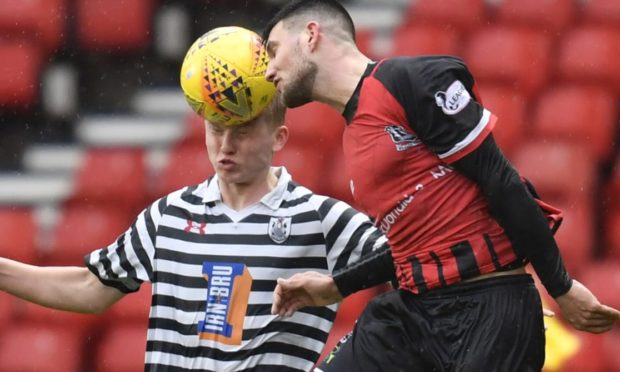 Queen's Park's Josh Doig (left) competes with Matthew Cooper during the Ladbrokes League 2 match between Queens Park and Elgin City at Hampden Park