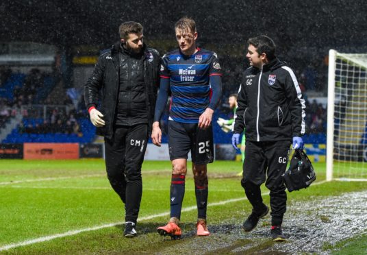 Coll Donaldson is helped from the field during last weekend's game.