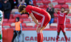 Aberdeen's Ash Taylor looks dejected at full time during the Ladbrokes Premiership match between Aberdeen and Celtic, at Pittodrie