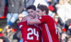 Aberdeen's Dean Campbell, left, is consoled by team-mates after being sent off during the Ladbrokes Premiership match between Aberdeen and Ross County