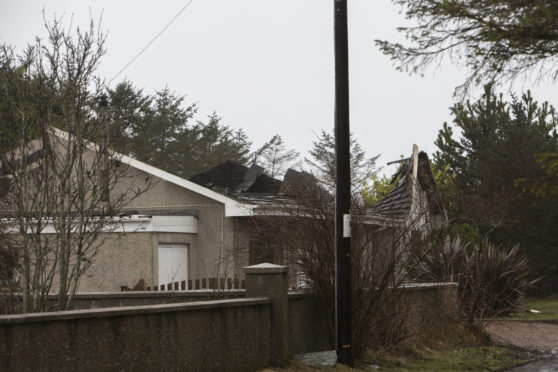 The roof of this house at Thrumster collapsed, following a fire on Monday night.