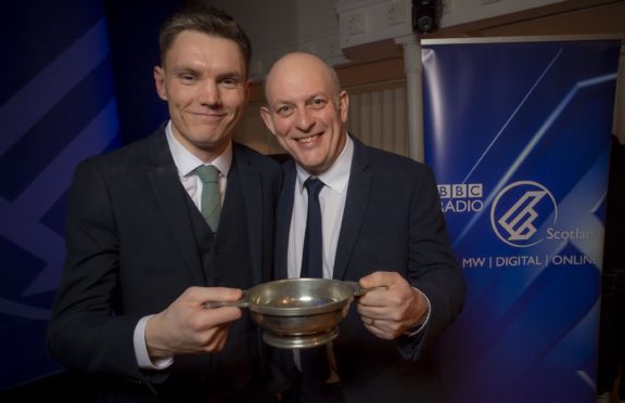 Ali Levack receives his award from Gareth Hydes, the commissioning editor of BBC Scotland