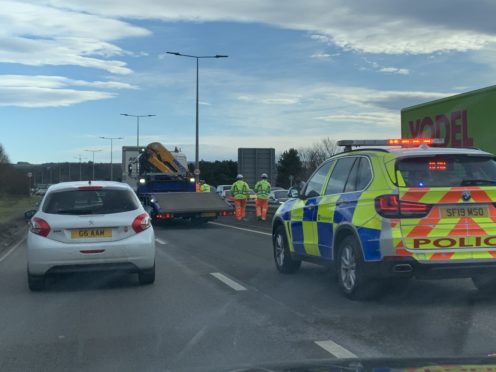Police at the scene of the crash on the A9 in Inverness.