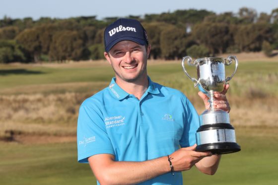 David Law of Scotland poses with the trophy after winning the Men's Victorian Open at 13th Beach Golf Links in Melbourne, Australia. Photo by DAVID CROSLING/EPA-EFE/Shutterstock