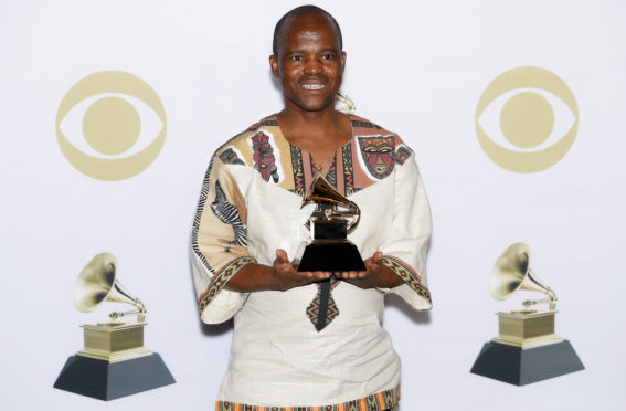 Mandatory Credit: Photo by Justin Lane/EPA-EFE/Shutterstock (9337218bb)
Joseph Shabalala
Press Room - 60th Annual Grammy Awards, New York, USA - 28 Jan 2018
Joseph Shabalala of the group Ladysmith Black Mambazo holds the Grammy for Best World Music Album in the press room during the 60th annual Grammy Awards ceremony at Madison Square Garden in New York, New York, USA, 28 January 2018.