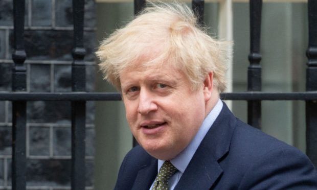 Boris Johnson leaves Downing Street to go to the House of Commons for Prime Minister's Questions.