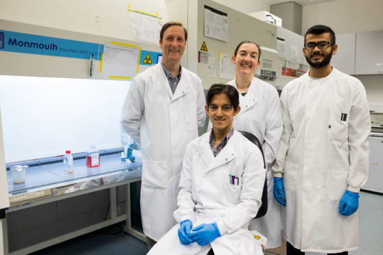 Dr Ian Fleming (back left) with Dr Kirsten Laws (back middle) and PhD students are Andrew Mohan (front) and Bandar Alwadani (back right)