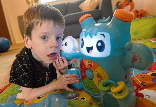 Four year old Aaron Nisbet of Invernes who suffers from an extremely rare medical condition. Picture by Sandy McCook