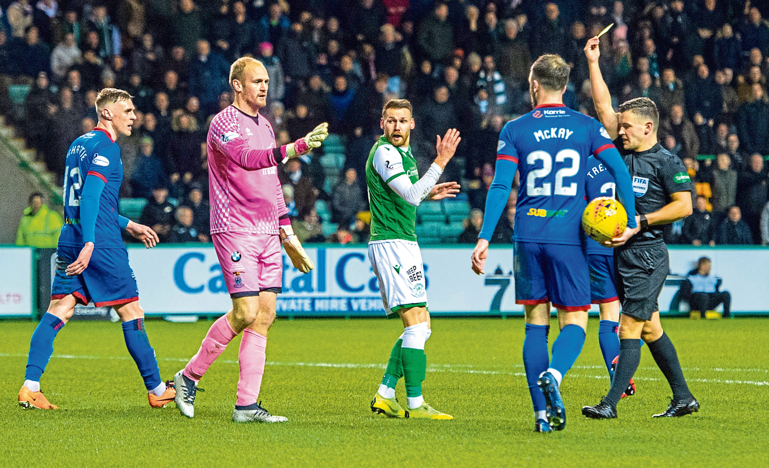 Martin Boyle goes down in the box under challenge from Mark Ridgers and is subsequently yellow carded for simulation during the William Hill Scottish Cup quarter-final.