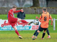 Formartine's Graham Rodger competes for possession.