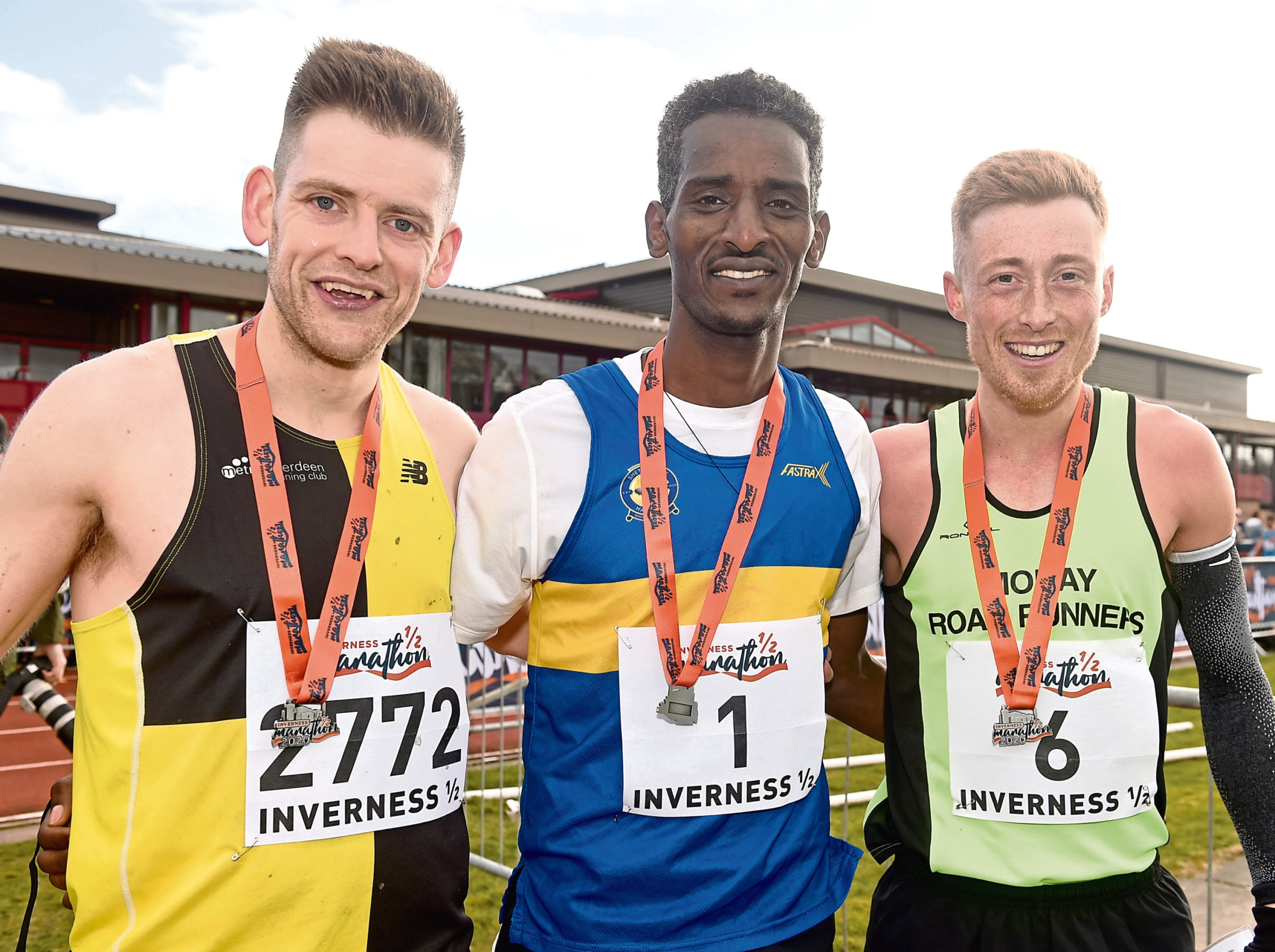 Weynay Ghebreselasie, centre, mens half marathon winner with runner-up Kenny Wilson (right) and third-placed Cameron Strachan.
Picture by Sandy McCook
