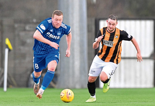 Scott Brown, left, in action for Peterhead.