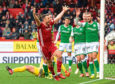Andy Considine celebrates scoring against Hibs in the last game before the shutdown. The veteran is another player who has performed well over the campaign.