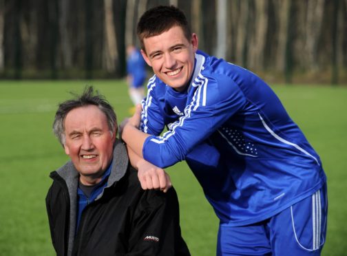 Strathspey Thistle chairman Donly McLeod with grandson James McShane, who plays for the Jags.
