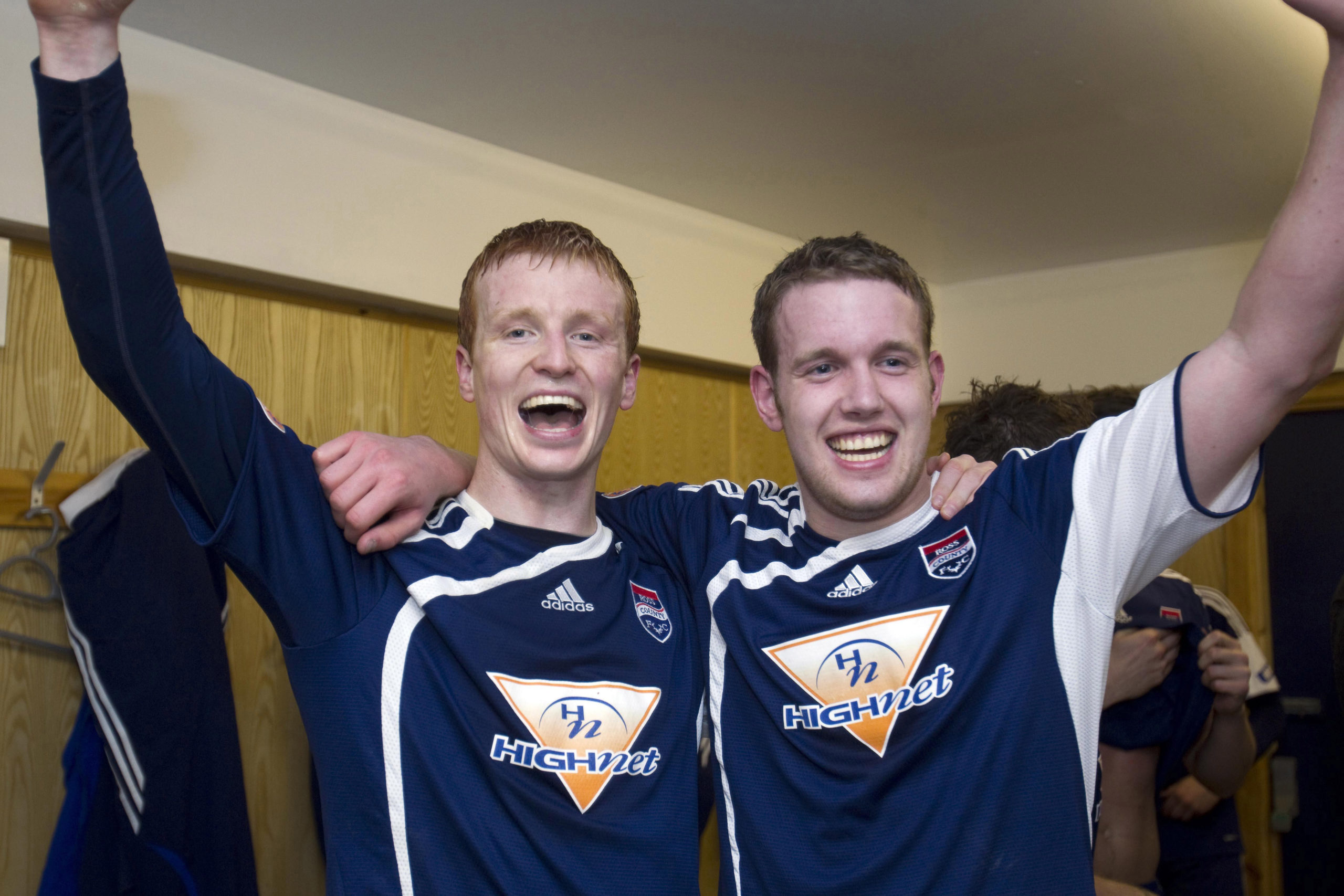 Ross County's Scott Boyd and Garry Wood celebrate in the dressing room following victory over Hibs.