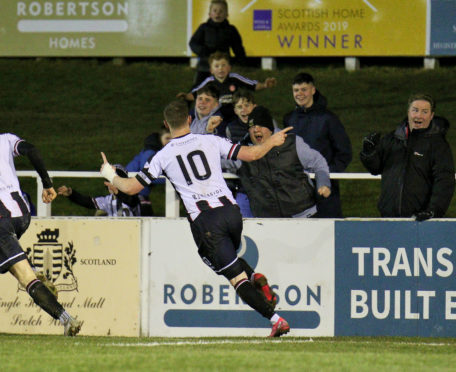 Shane Sutherland celebrates Elgin's second.