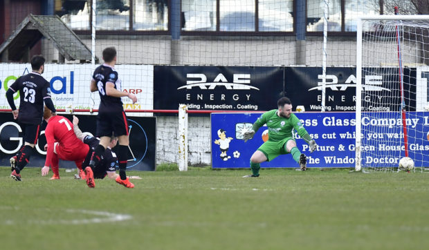 Greg Morrison fires past Wick keeper Gordon Clark to open the scoring for Brora.