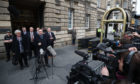 Alex Salmond (left) speaks to the media as he leaves the High Court in Edinburgh after he was cleared of attempted rape and a series of sexual assaults