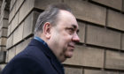 Former Scottish first minister Alex Salmond leaving the High Court in Edinburgh, on the first day of his trial over accusations of sexual assault, including one of attempted rape.
