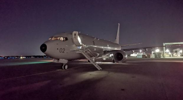 The City of Elgin Poseidon plane on the runway before leaving for Scotland.