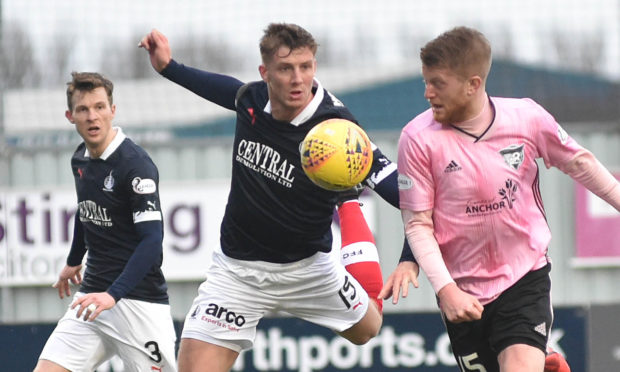 PETERHEAD'S  ALAN COOK GETS THE BETTER OFF BEN HALL