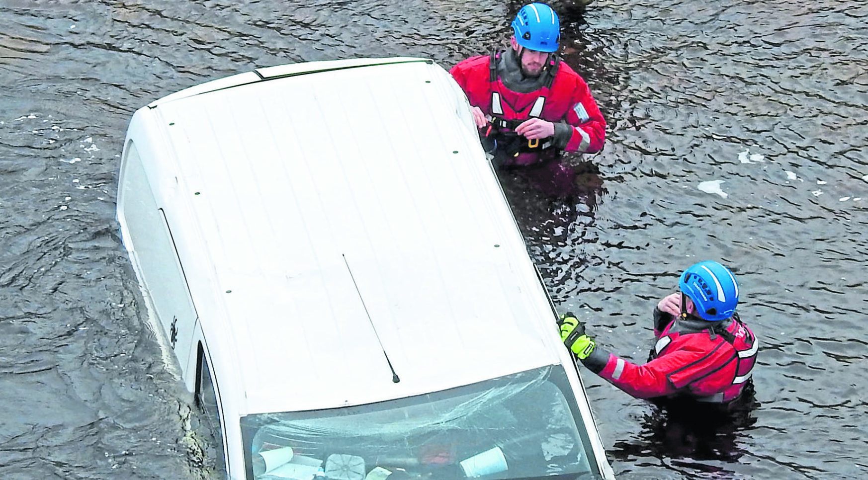 Searching the crashed vehicle in the River Etive.  Photograph by Iain Ferguson