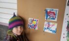 Meredith Clarke, 5, creating her tiles, inspired by Dunnet Bay and the surfers.