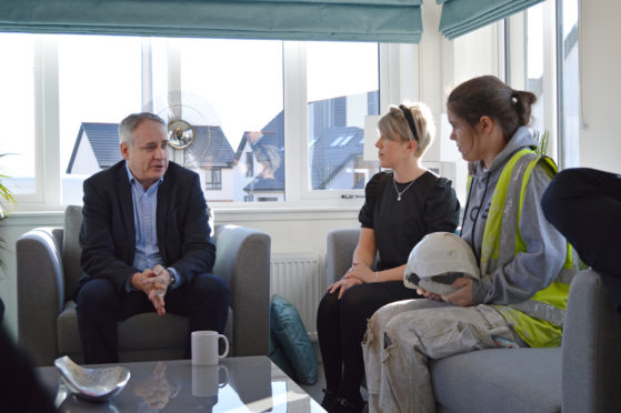 Scottish Government minister Richard Lochhead with Springfield's senior HR advisor Diane Kemp and apprentice painter Sophia Massie.