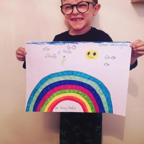 Smile! Artist Ethan Worthington, aged 6, from Nairn, with his rainbow. 
From Nairn
