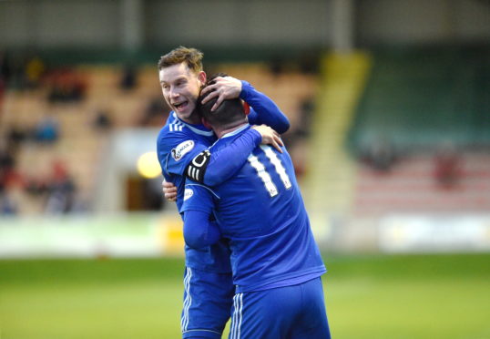 Cove's Jamie Masson celebrating with Mitch Megginson. 
Picture by Darrell Benns