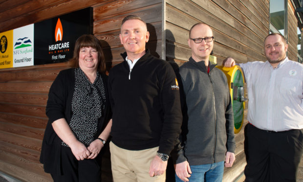 Pictured: Susan Hutcheon from Keith Community Council, Calum McCombie from Heatcare Oil and Gas Ltd, Dave Chapman from Moray Defibs and Grant Henderson from Tesco. Picture by Jason Hedges.