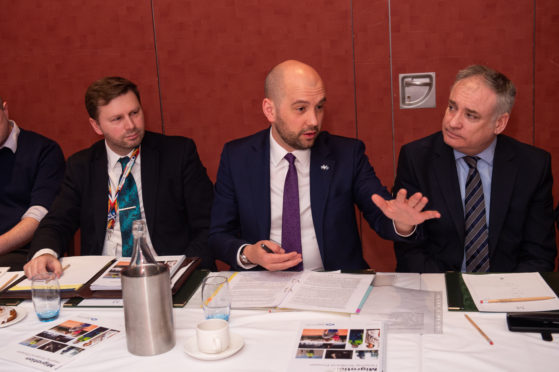 Scottish Government minister Ben Macpherson, pictured centre, addresses the Elgin meeting. 
Picture by Jason Hedges.