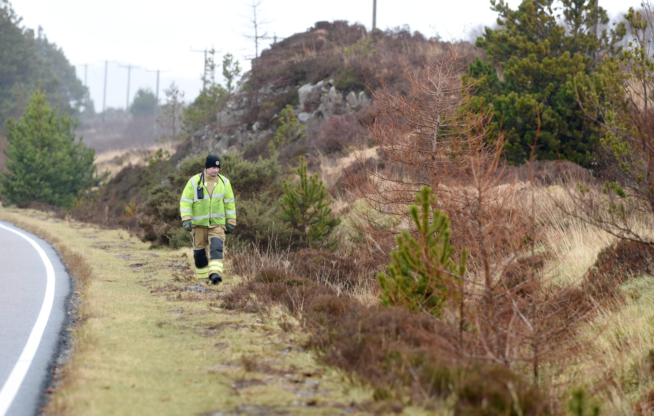 Members of the fire service searching the route between Kyleakin and Broadford on Tuesday.