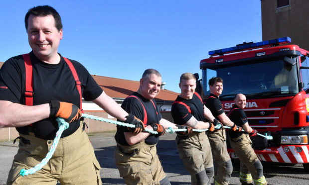PETERHEAD FIREFIGHTERS GET IN SOME TOWING PRACTISE ON A 13 TON APPLIANCE.(L TO R) WILL BURTT, ROBBIE STURROCK , STEWART MCKENZIE,OLIVER CRICHTON AND GARY DONALD