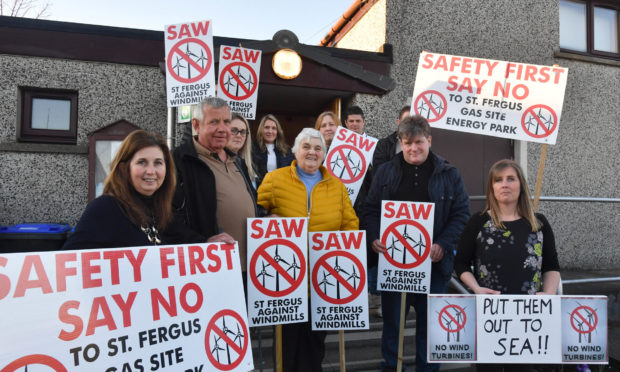 ST FERGUS VISITORS PROTESTING AGAINST PROPOSED WIND TURBINES NEAR THEIR VILLAGE