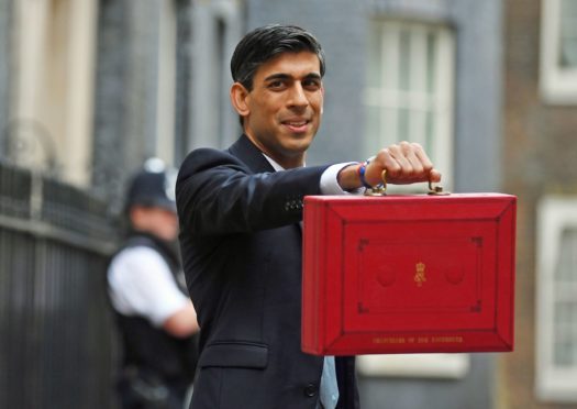 Chancellor Rishi Sunak outside 11 Downing Street, London, before heading to the House of Commons to deliver his Budget.