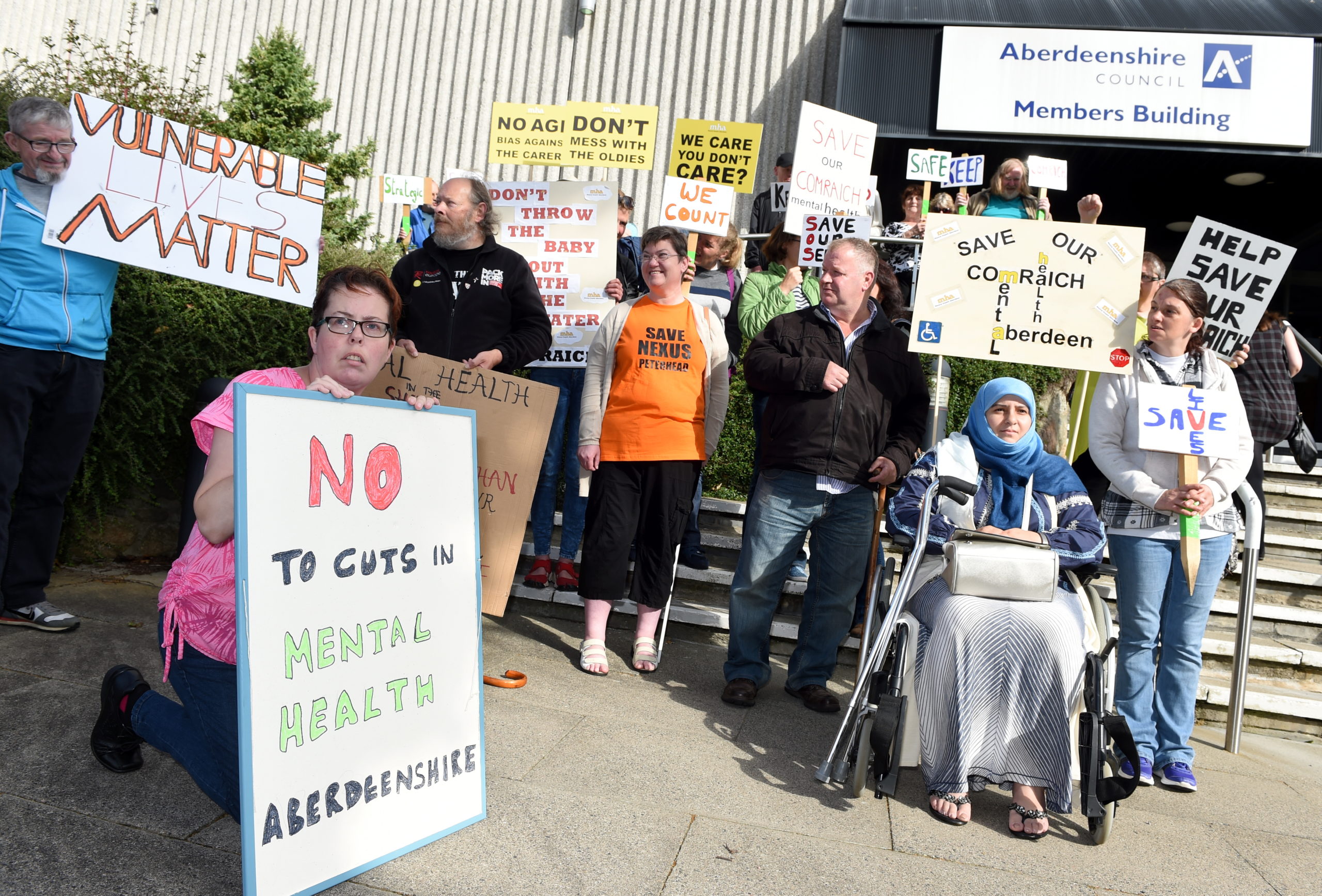 Protestors outside Aberdeenshire Council after cuts to Mental Health support in the region