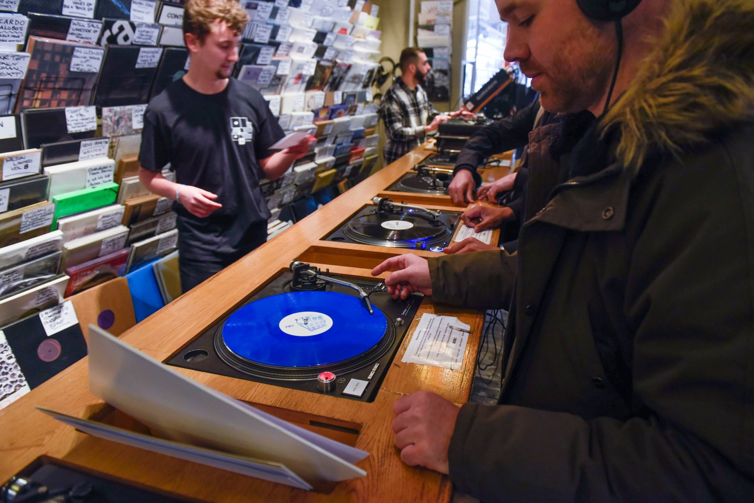 Photo by Stephen Chung/LNP/Shutterstock (10203276c)
Customers listen to LPs in Phonica Records. Analogue music fans visit independent record shops in Soho to celebrate vinyl music on the 12th Record Store Day.
Record store day, London, UK - 13 Apr 2019
Over 200 independent record shops across the UK come together annually to celebrate the unique culture of analogue music with special vinyl releases made exclusively for the day. In 2018, sales of vinyl rose for the 11th consecutive year to 4.2 million units according to the British Phonographic Industry (BPI).
